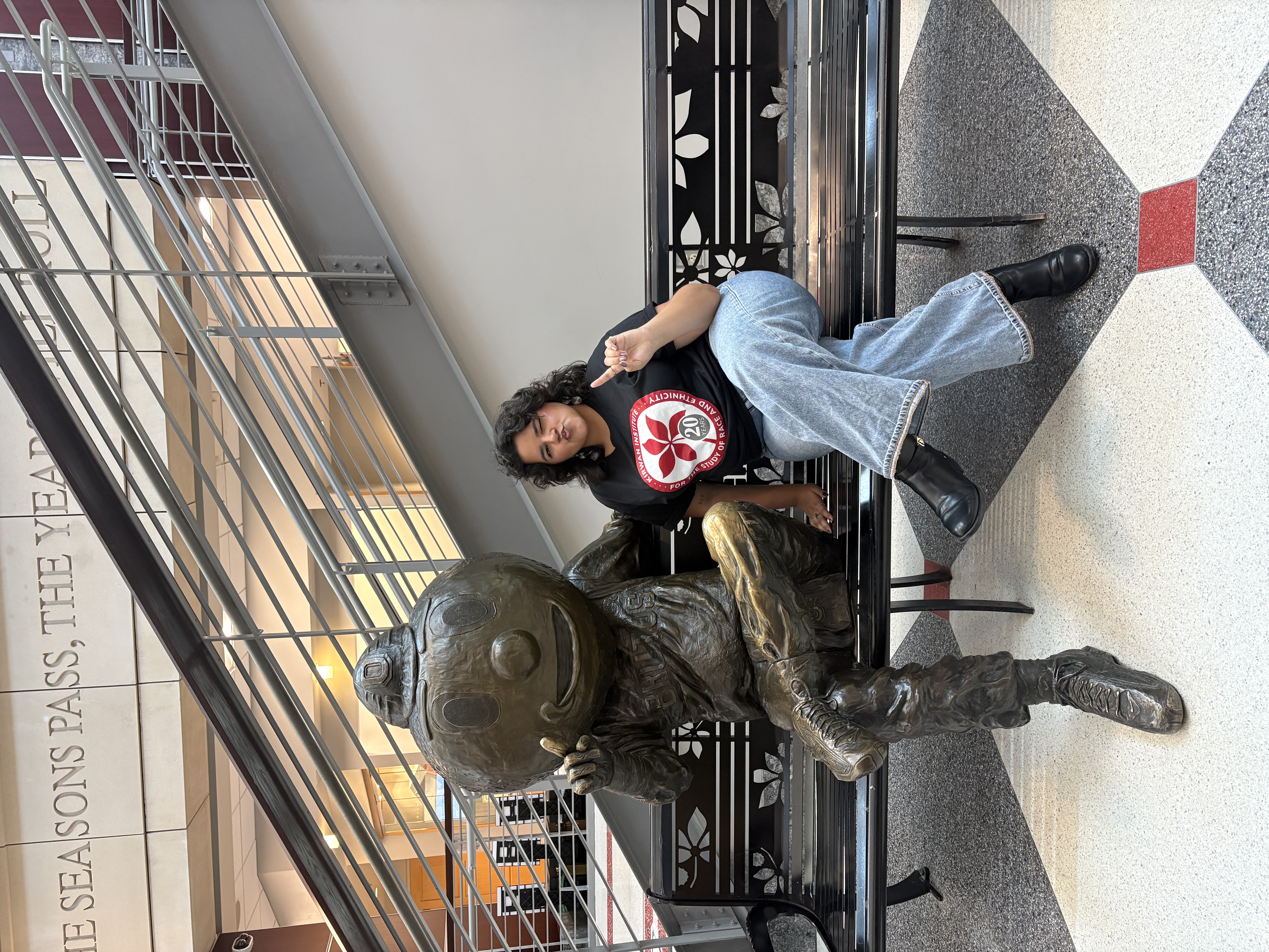Wilmarie next to the Brutus statue in the Ohio Union
