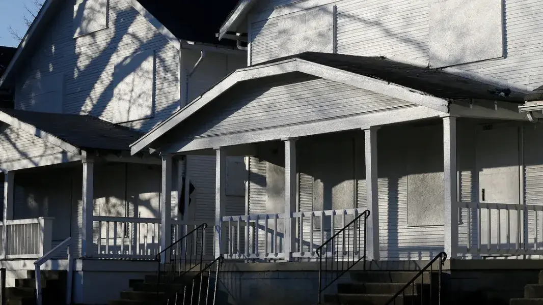 Front facade of two gray houses