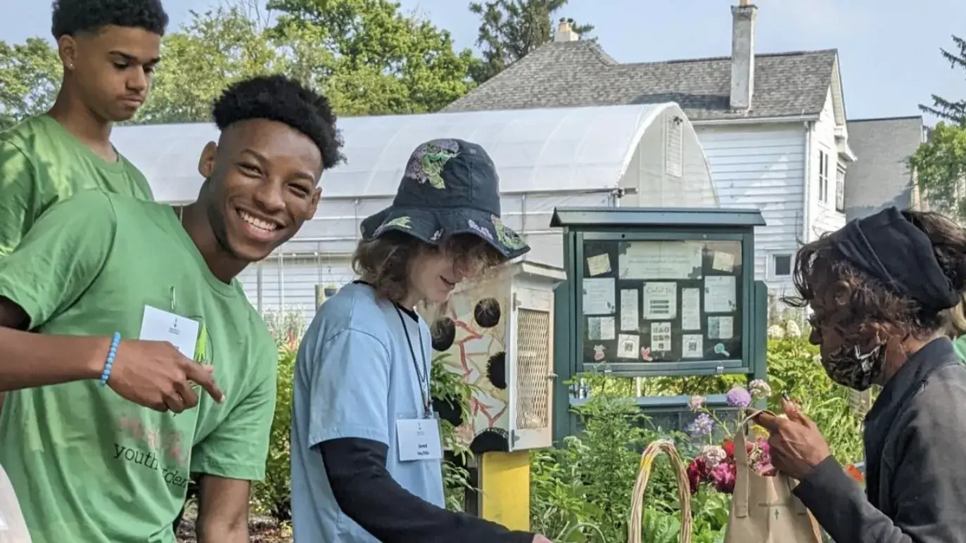 Columbus Highland youth working in a garden