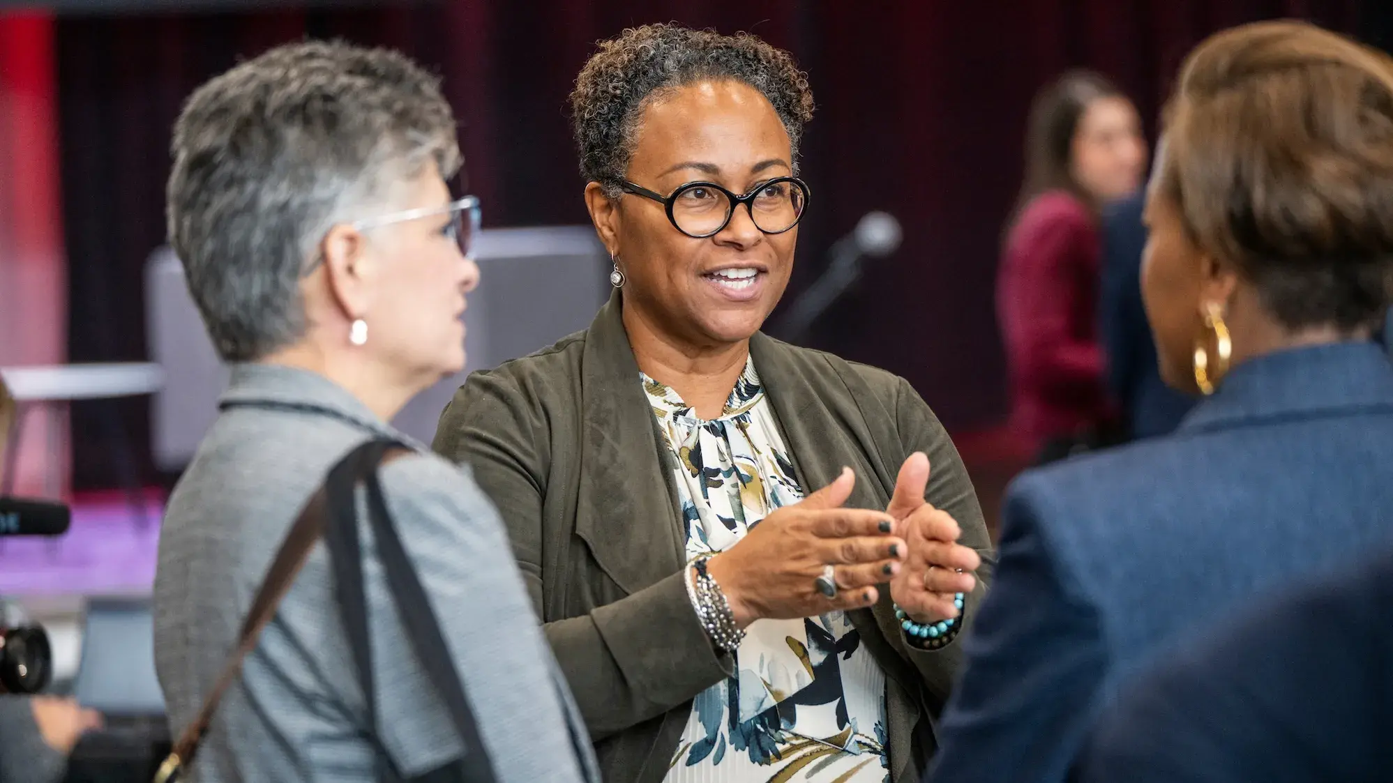 Three people having a conversation