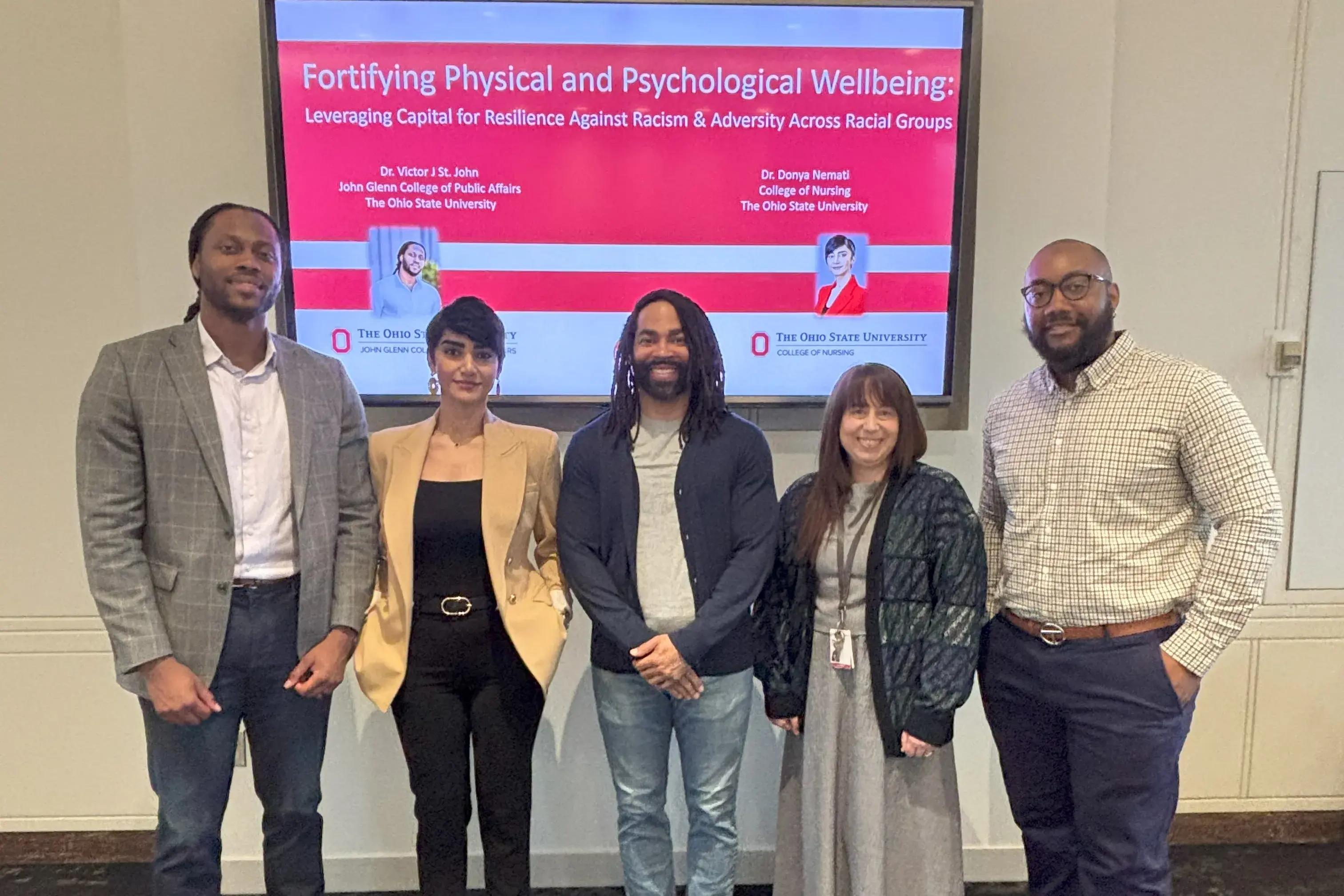 A group photo of 5 Faculty Affiliates posing at a Kirwan Forum Series. 